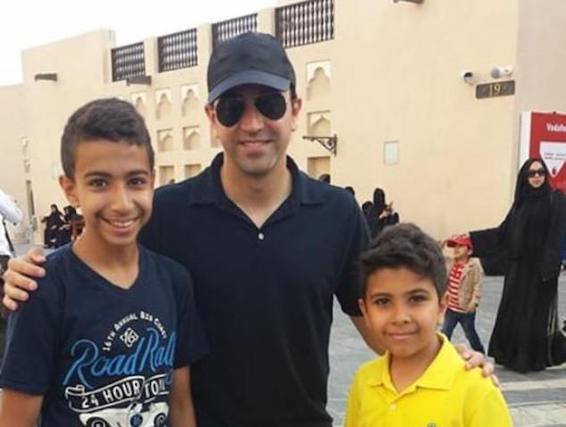 Xavi poses with fans for a picture in Qatar